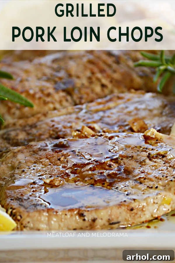 Tender grilled pork loin chops topped with balsamic glaze and garnished with fresh rosemary and lemon slices.