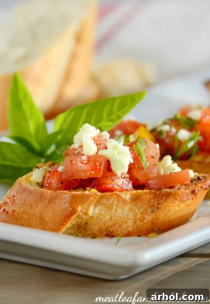 toasted bread topped with tomatoes, gorgonzola cheese and basil