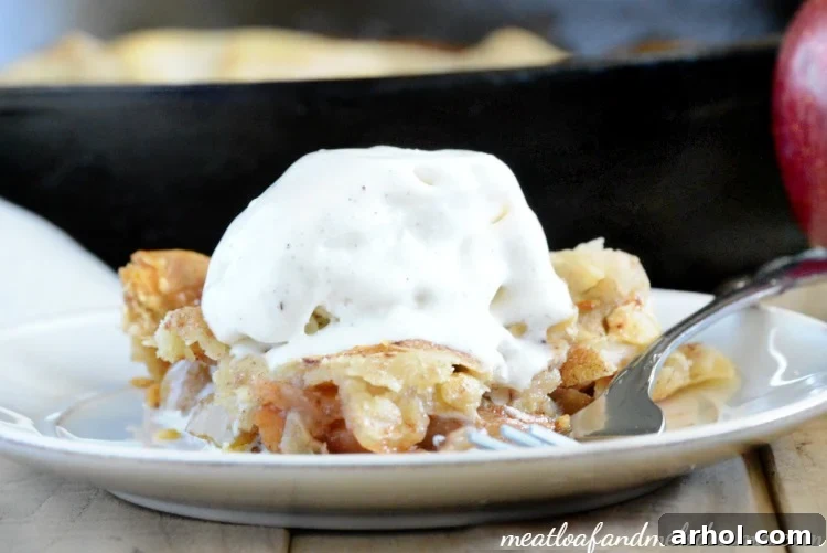 A tantalizing slice of apple pie served with a scoop of melting ice cream, a perfect dessert.