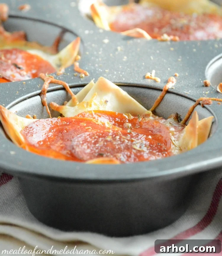 Pizza Dip Wonton Cups Arranged in a Muffin Tin