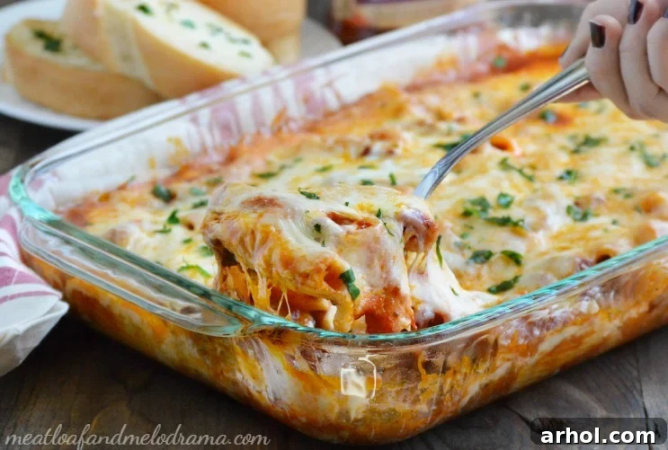 Delicious One-Pan Rigatoni Sausage Bake with melted cheese and fresh parsley garnish