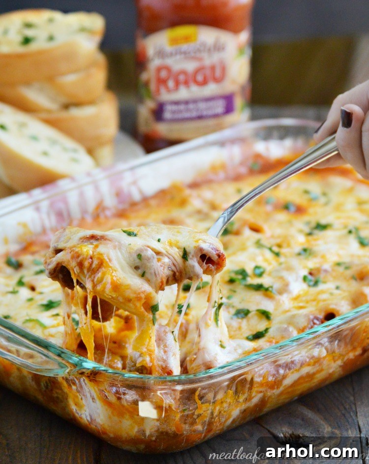 Large baking dish filled with golden-brown One-Pan Rigatoni Sausage Bake, ready to serve