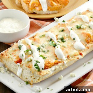 Top view of Easy Buffalo Chicken French Bread Pizza with melted cheese.