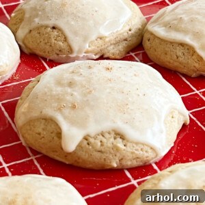 Glazed eggnog cookies attractively arranged on a festive red plate, ready to be enjoyed.