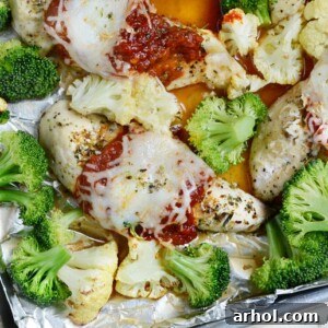Sheet Pan Skinny Chicken Parmesan with broccoli and cauliflower, a lighter low-carb recipe without breading, ready in 30 minutes.