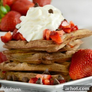 Chocolate Belgian Waffles with chocolate chips and strawberries, a delicious breakfast recipe.