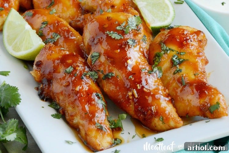 Delicious Baked Honey Chipotle Chicken Tenders on a baking sheet, ready to be served