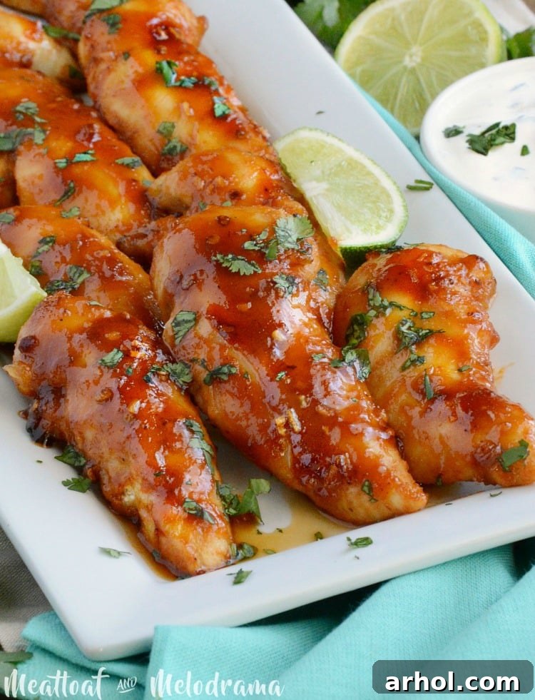 A platter of Baked Honey Chipotle Chicken Tenders, garnished and ready to serve