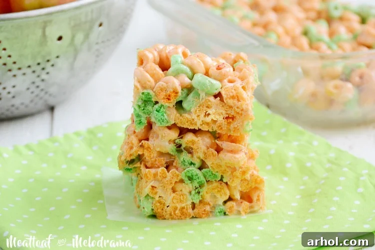 Stacked Apple Jacks marshmallow treats bars, showcasing their vibrant colors and chewy texture