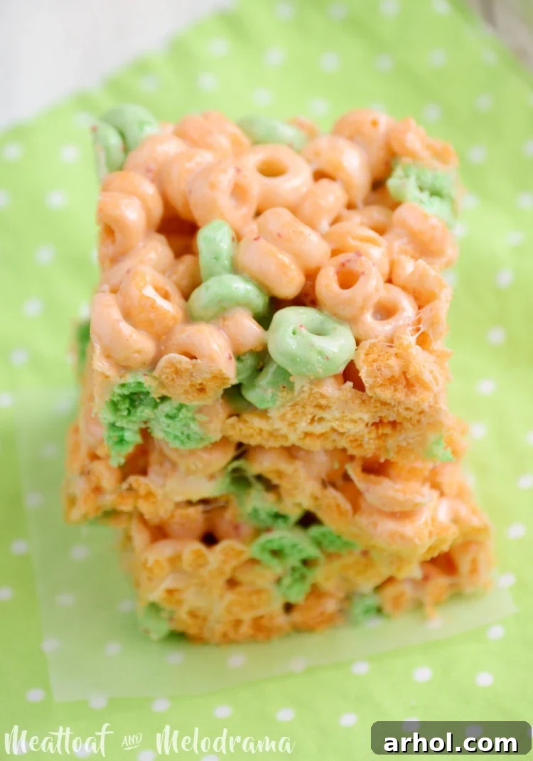 Close-up of Apple Jacks marshmallow bars, showing the crispy texture and marshmallow streaks