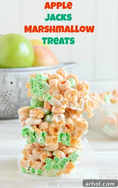 No-bake cereal bars made with Apple Jacks cereal and marshmallows, stacked and ready to eat