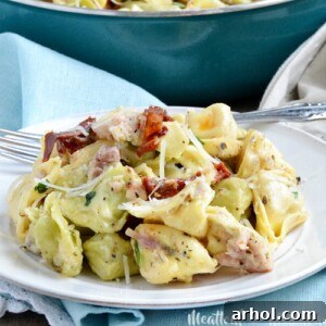 One Pot Cheesy Ham Tortellini Skillet dinner made with leftover ham