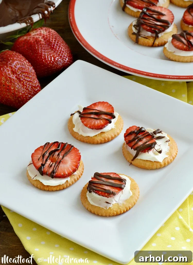 Chocolate drizzled strawberry RITZ crackers with cream cheese and sliced strawberries