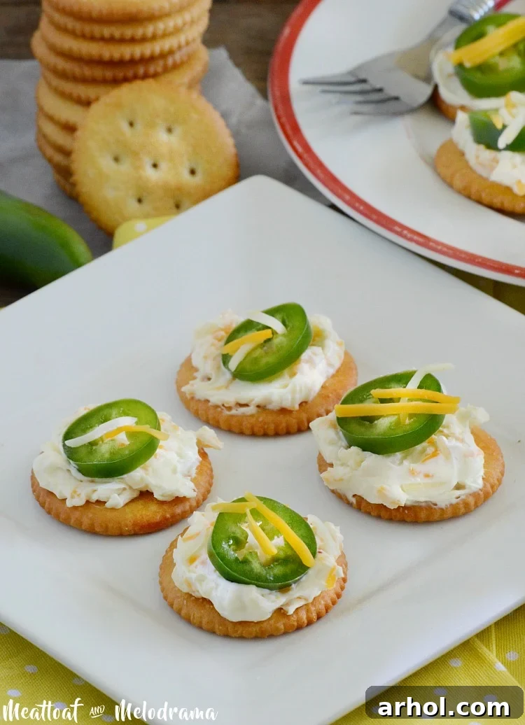 RITZ crackers with cream cheese, Mexican cheese blend, and sliced jalapeno peppers