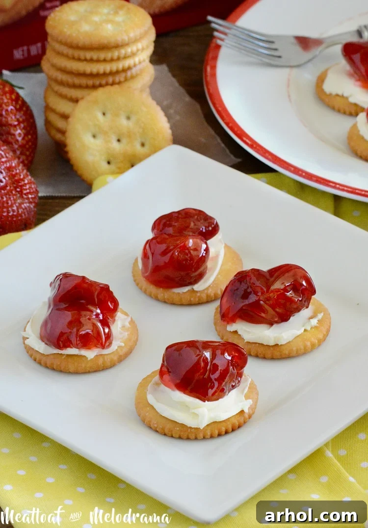 RITZ crackers with strawberry pie filling and cream cheese for a cheesecake bite