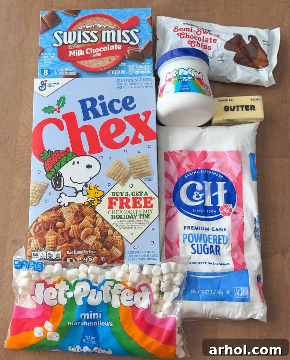 A beautifully arranged flat lay displays all the essential ingredients: Rice Chex cereal, marshmallow creme, powdered sugar, butter, mini marshmallows, hot cocoa mix, and glistening chocolate chips.