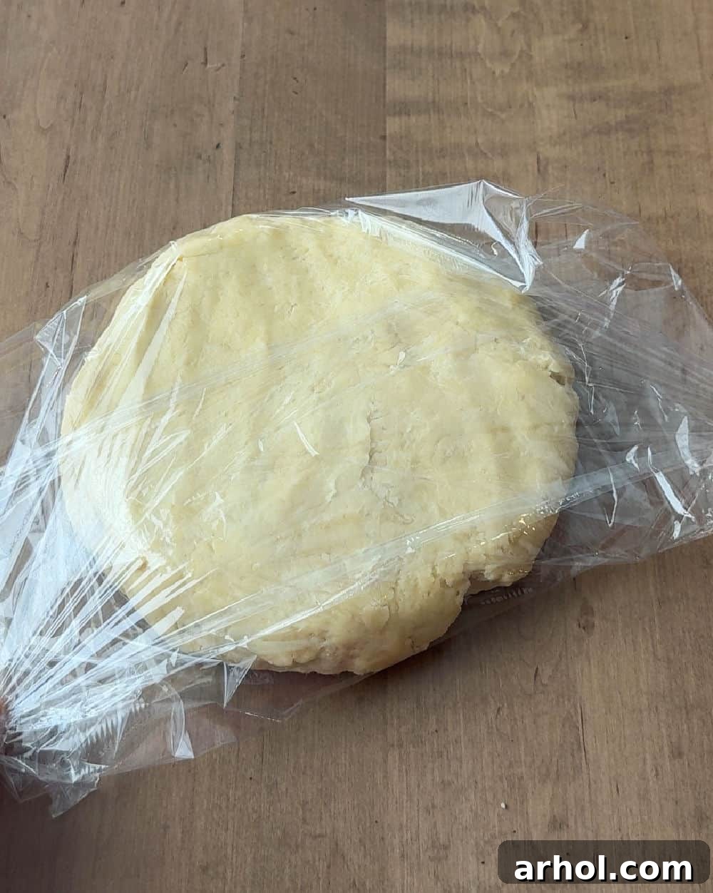 Wrapping the cookie dough securely in plastic wrap before chilling.