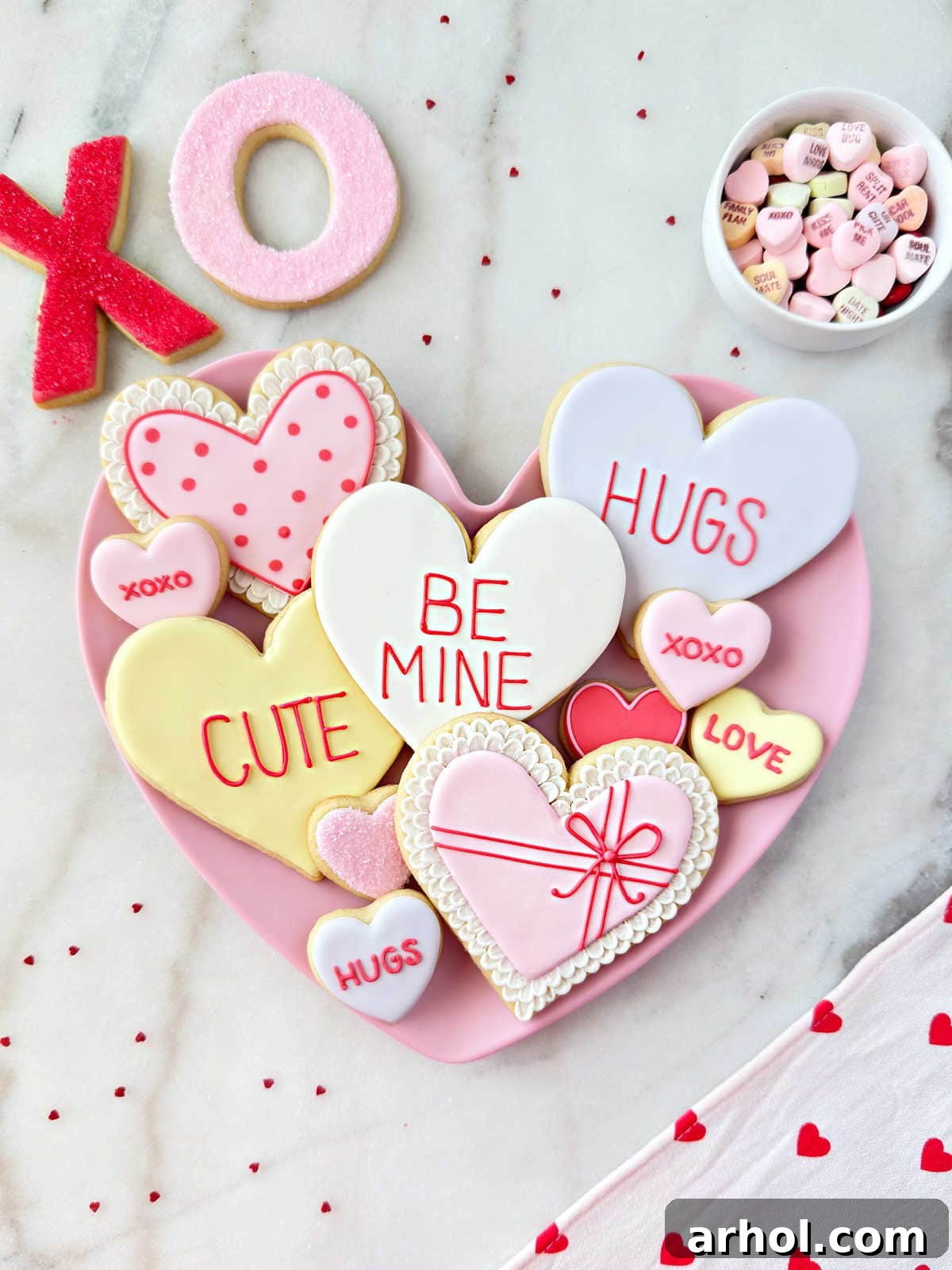 Delightful heart-shaped Valentine sugar cookies artfully arranged on a plate.
