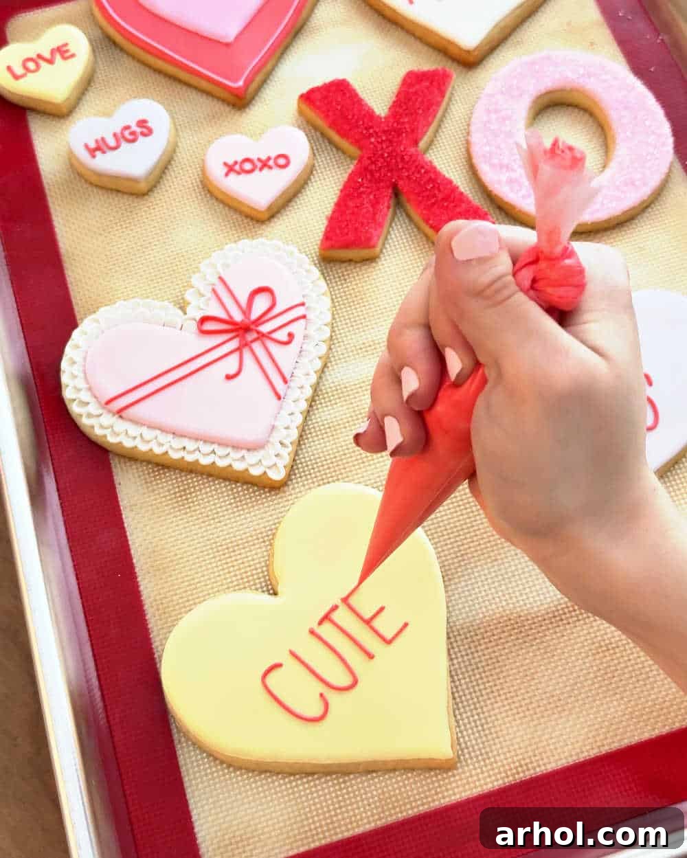 Decorating heart cookies with icing.