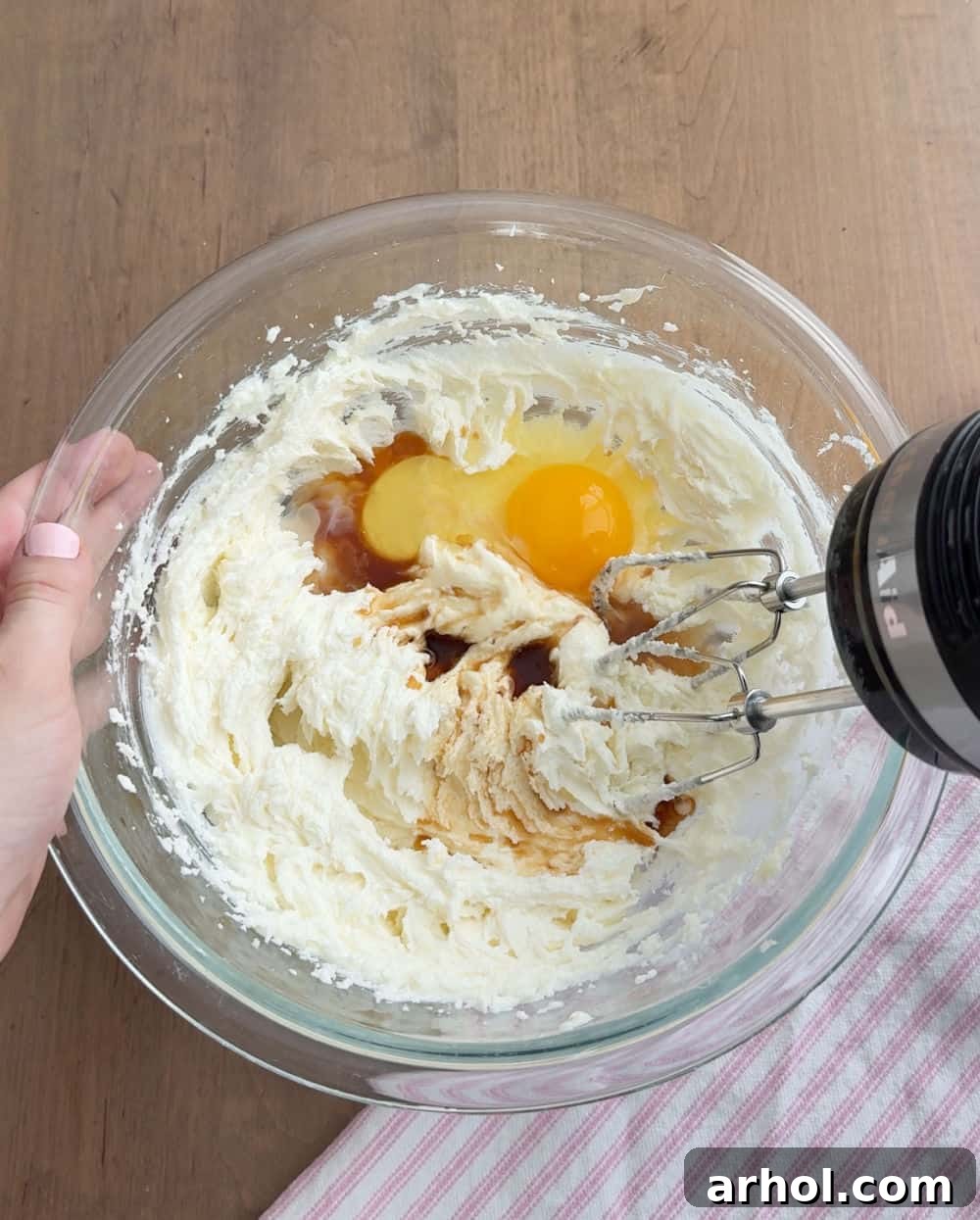 Mixing wet ingredients for cookie dough.