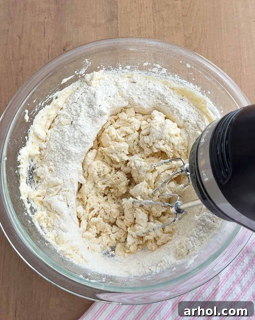 Mixing flour into dough.