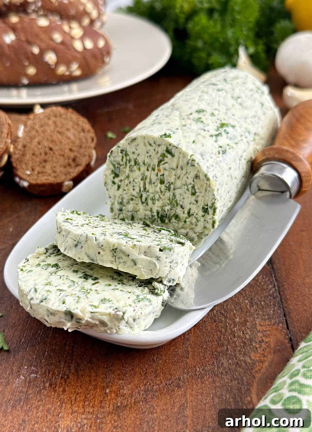 sliced garlic herb butter with bread.