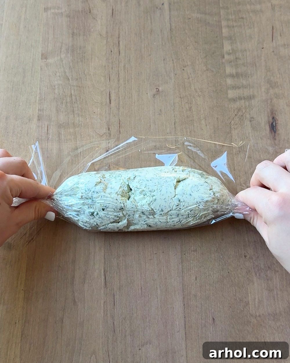 wrapping butter in plastic wrap.