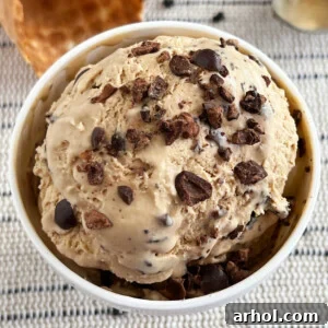 Bowl of no-churn coffee ice cream topped with chocolate-covered espresso beans.