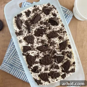 3-ingredient Oreo ice cream with Oreo cookies on top in a bread pan.