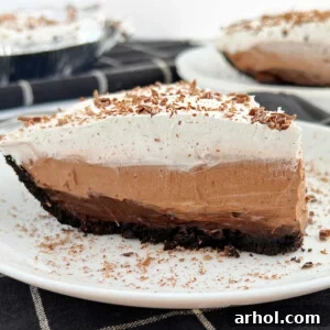 No-bake chocolate pudding pie with Jello pudding and Cool Whip on a plate.