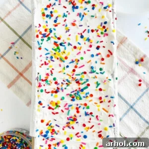 Ice cream sandwich cake with sprinkles in a loaf pan, ready for a party.