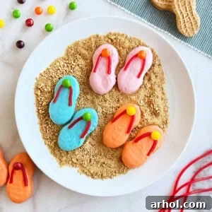 Nutter Butter flip flop cookies decorated with candy on a plate.