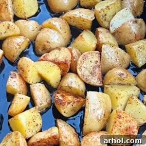 Crispy fried potatoes cooked to golden perfection on a Blackstone griddle.