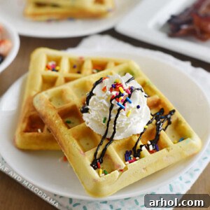 Funfetti waffles with whipped cream and colorful sprinkles