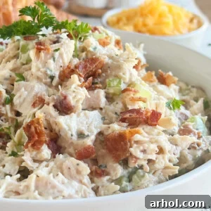 close up of ranch chicken salad with bacon and cheddar cheese in a large bowl