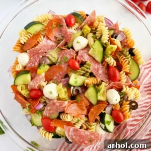 Italian pasta salad with pepperoni, rotini pasta and fresh vegetables in bowl
