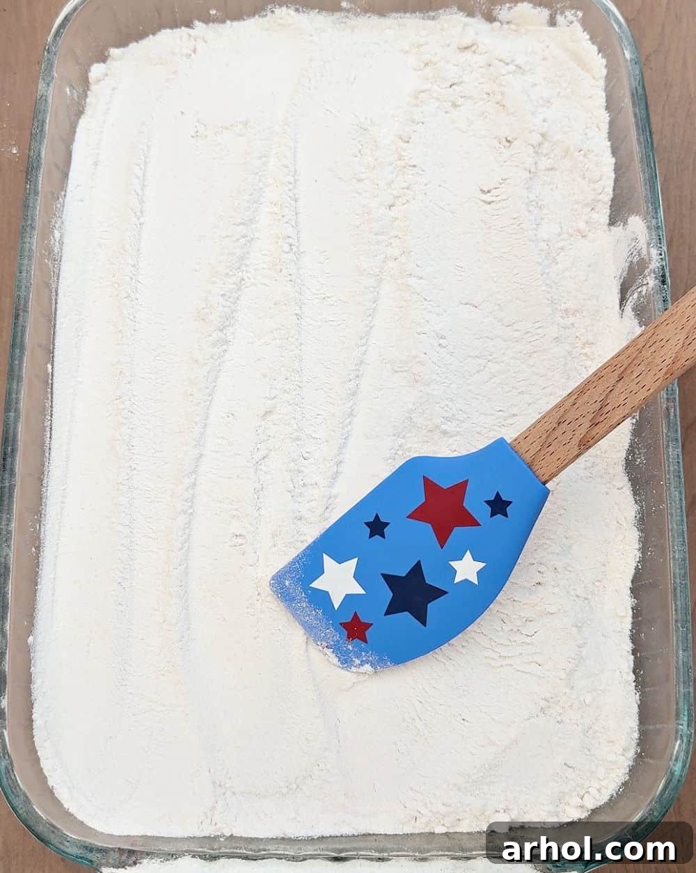 smoothing cake mix with star spatula.
