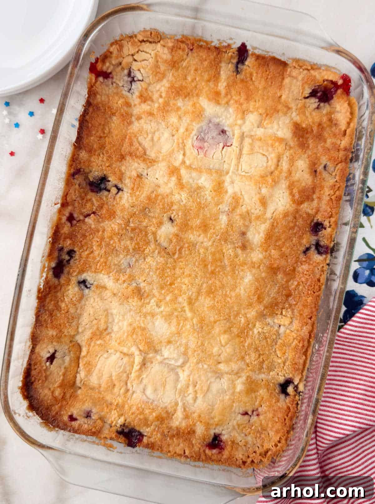 red white and blue dump cake in baking pan on the table.