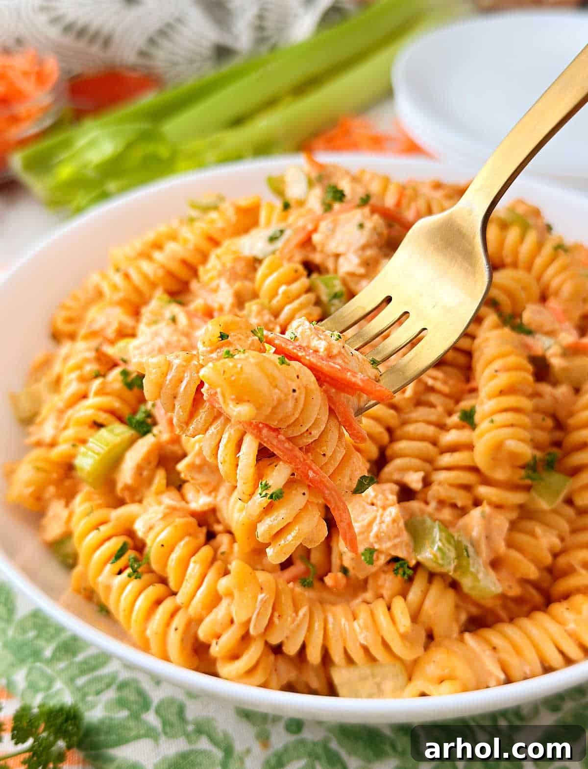 buffalo chicken pasta salad on a fork.
