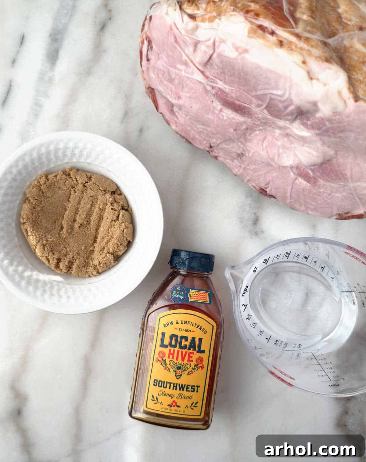 Perfect Oven-Baked Ham Slices: Easy, Juicy Recipe for Weeknight Dinners 4 cooked spiral ham, brown sugar, honey, water.