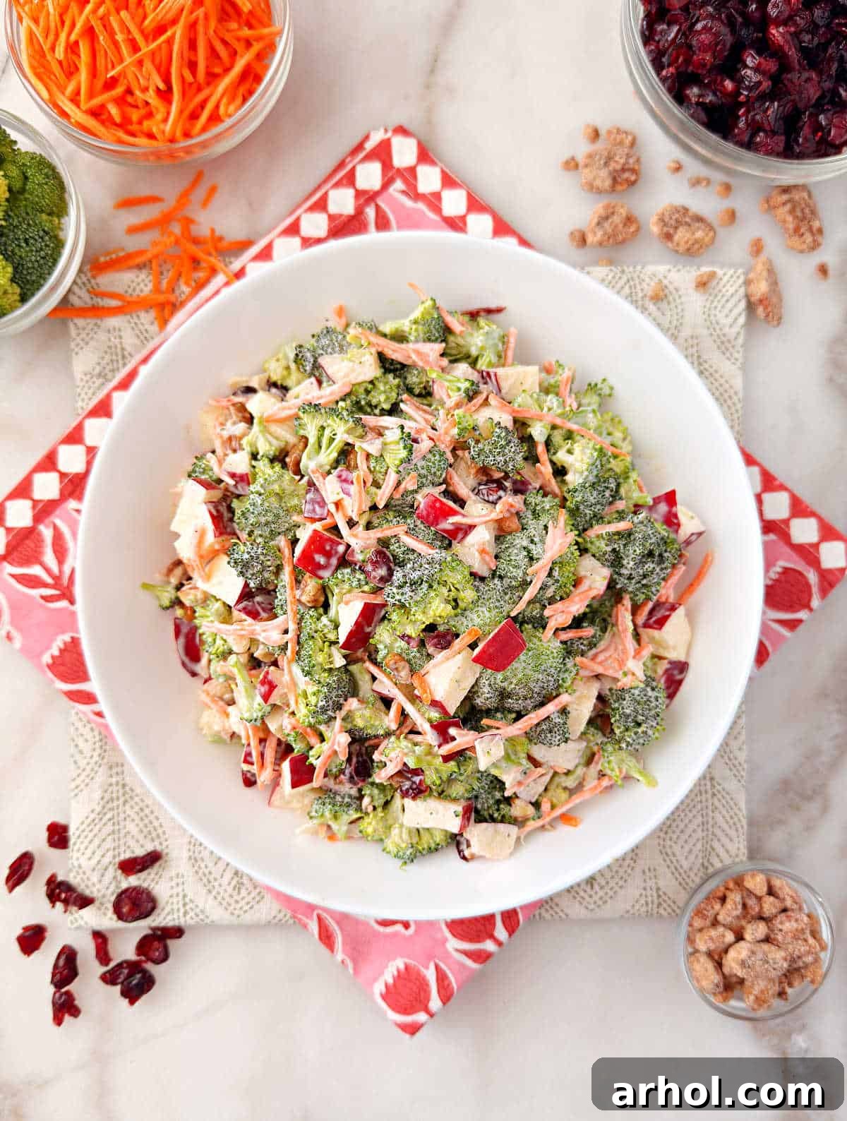 bowl of broccoli cranberry salad on the table.
