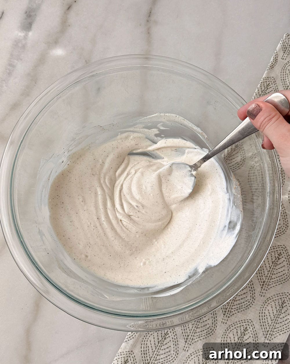 mixing dressing with spoon.