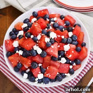 watermelon feta blueberry salad in a white bowl on the table.