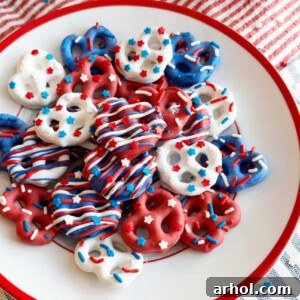 red white and blue pretzels with patriotic sprinkles on a red and white plate.