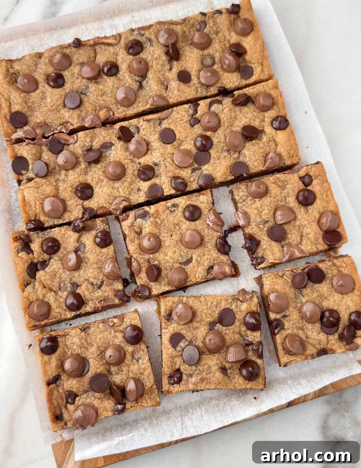 peanut butter chocolate chip cookie bars cut into squares.