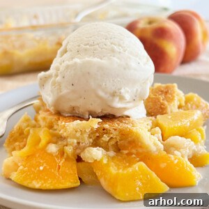 peach dump cake recipe with scoop of vanilla ice cream on top