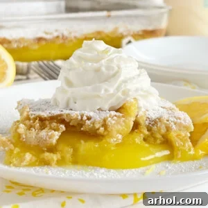 lemon dump cake with whipped cream on the table
