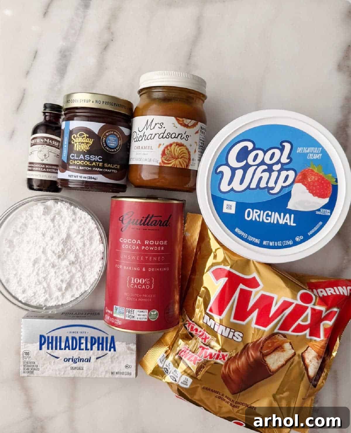 cool whip, cream cheese, Twix bars, cocoa, vanilla, sugar, toppings.
