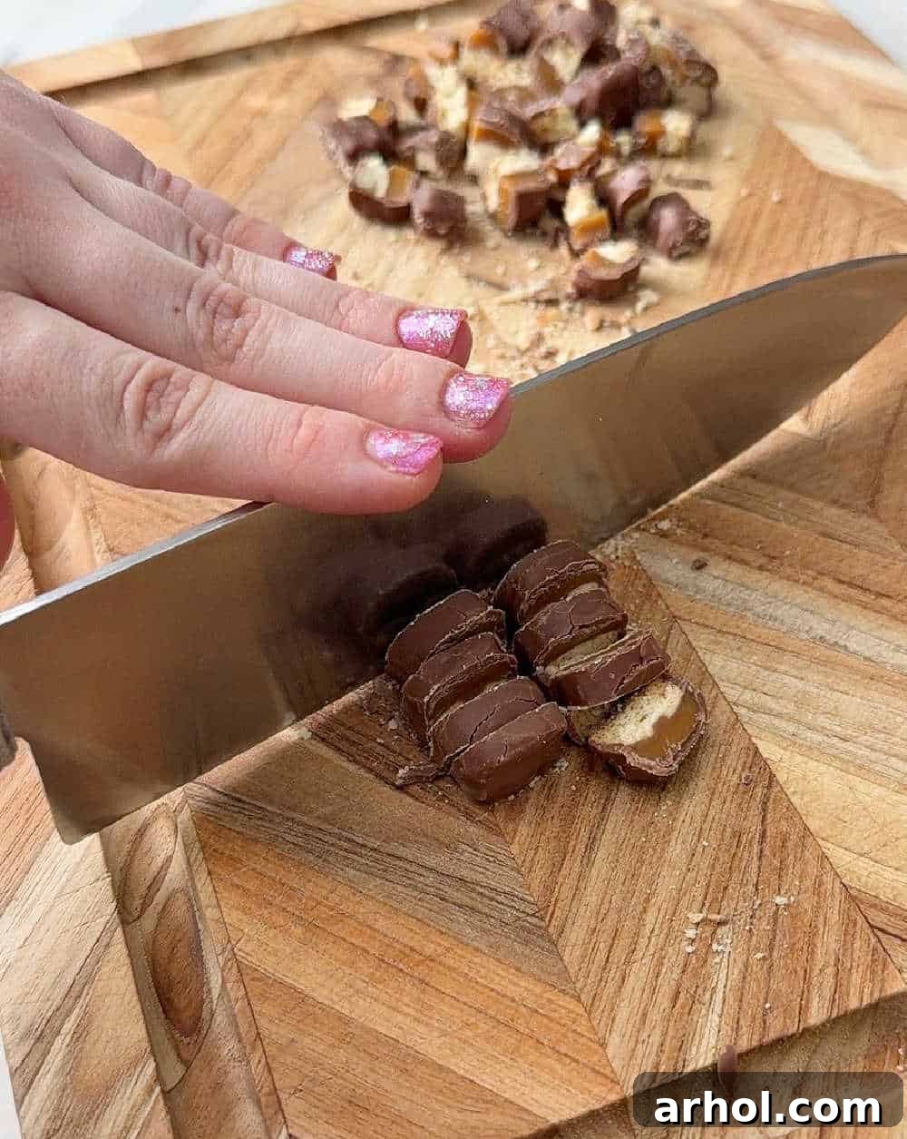 chopping candy on cutting board.