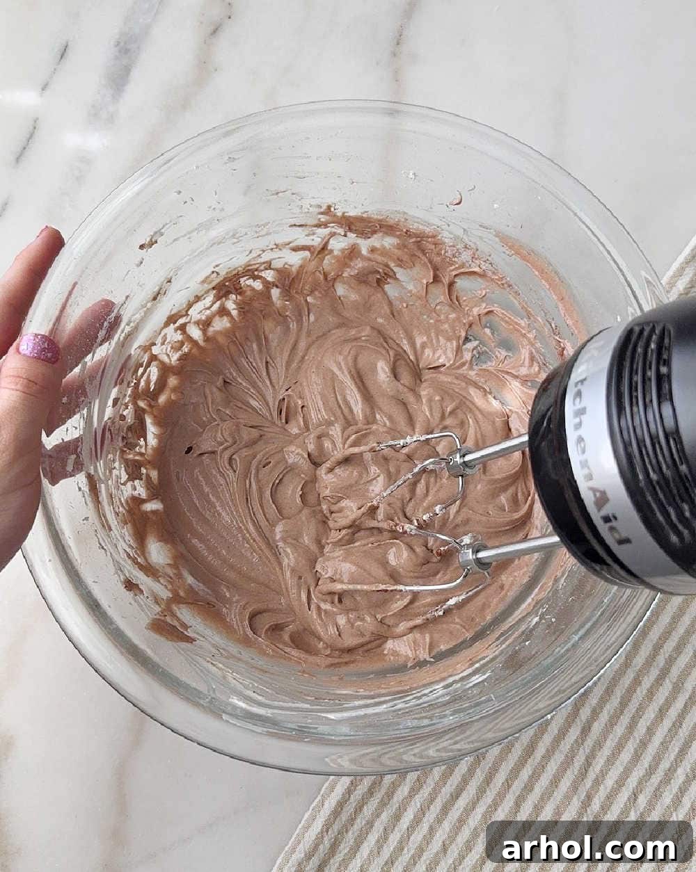 mixing ingredients in glass bowl.